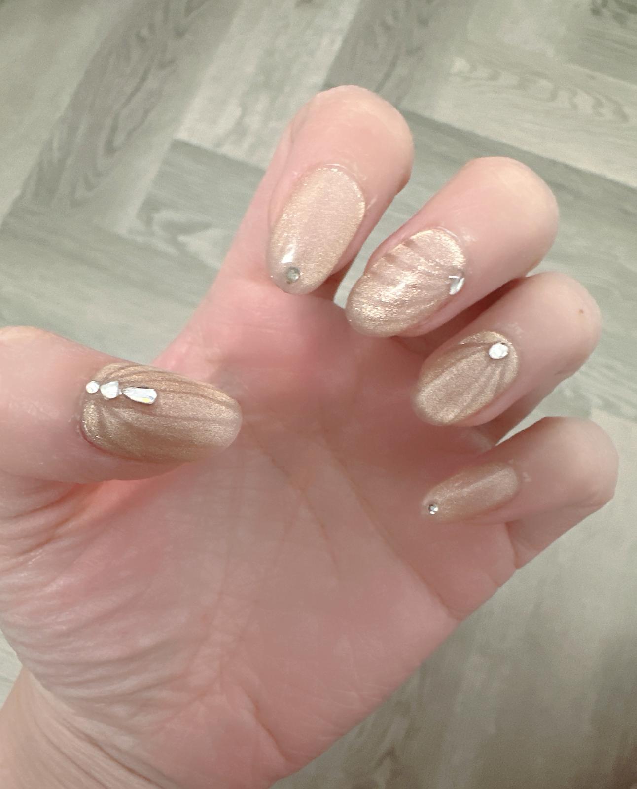 Gold shimmer press-on nails with crystals