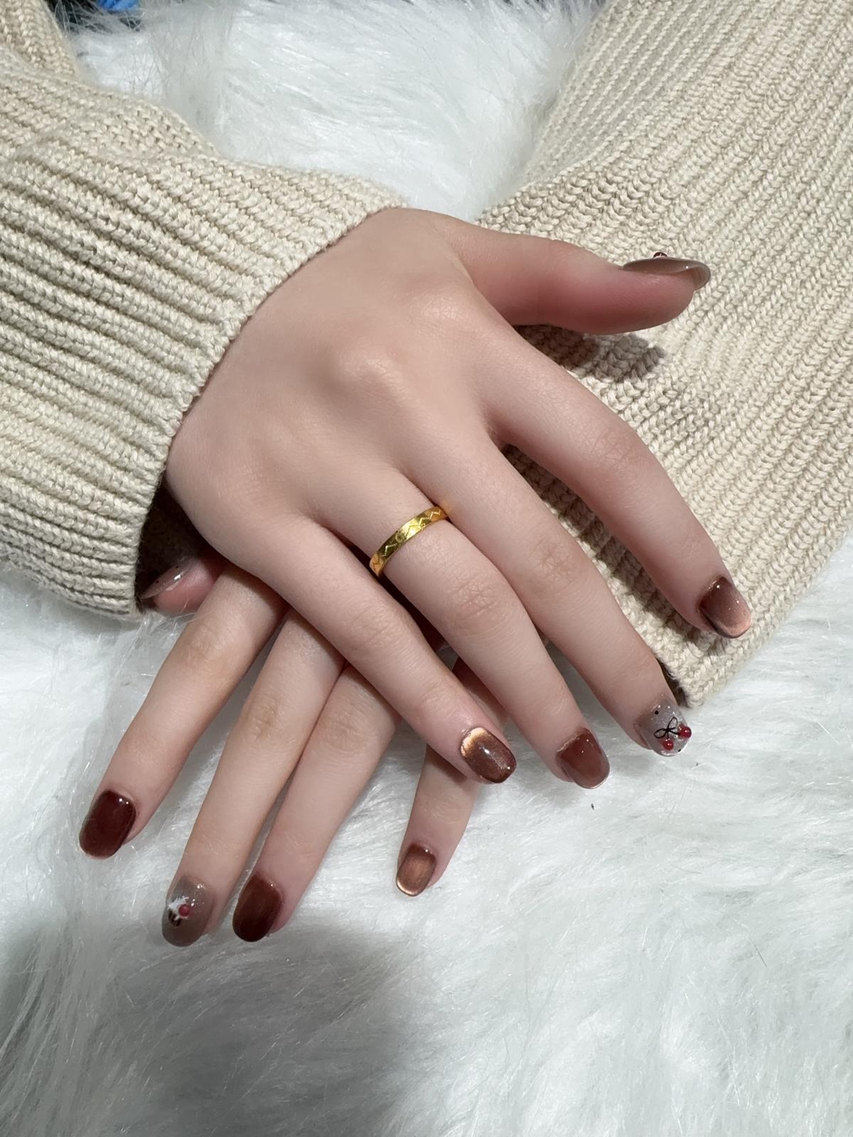 Burgundy press-on nails with bow detail