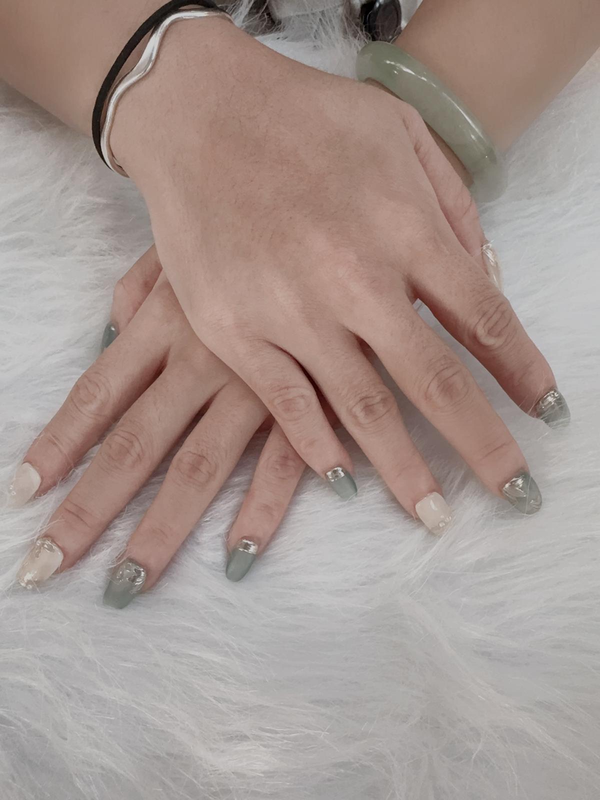 Sage green press-on nails with silver foil